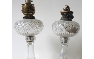 A PAIR OF CUT GLASS OIL LAMPS, early 20th century, with flar...