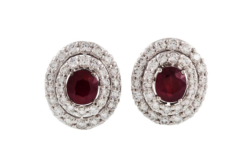 A PAIR OF RUBY AND DIAMOND CLUSTER EARRINGS, the oval rubies...
