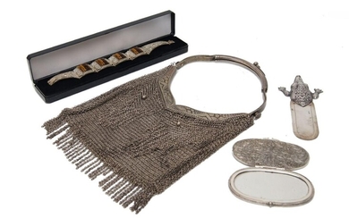 A Polish chain mesh handbag, stamped for 800 silver, Warsaw, 1920-1963, together with a silver bookmark with repousse crocodile terminal; a filigree bracelet applied with carved tiger's eye lozenges, 18cm long (unmarked), and an oval filigree...