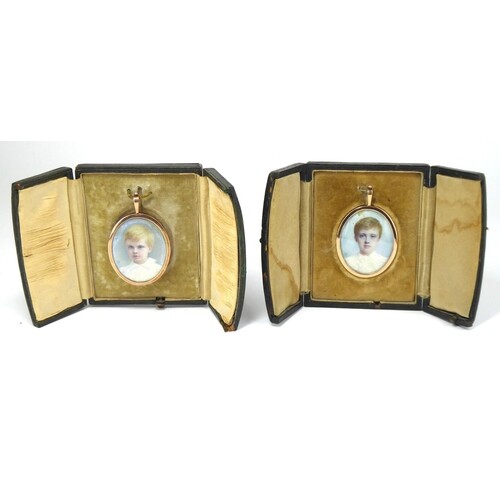 A RARE PAIR OF CASED 9CT GOLD AND IVORY OVAL MINIATURE PORTR...