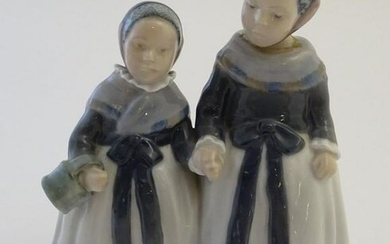 A Royal Copenhagen figure of two Amager girls in