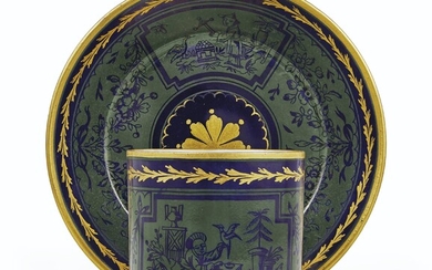 A SEVRES BLEU NOUVEAU 'MOSS AGATE' GROUND CUP AND SAUCER (GOBELET 'LITRON' ET SOUCOUPE, 2EME GRANDEUR), CIRCA 1788, GILT INTERLACED L'S ENCLOSING DATE LETTER LL, GILDER'S MARK FOR L.-F. L'ECOT, THE CUP INCISED PFE T C.G, THE SAUCER INCISED CD AND RN
