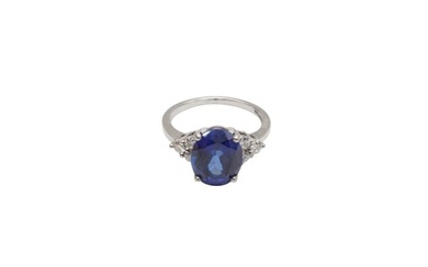 A SYNTHETIC SAPPHIRE AND DIAMOND RING