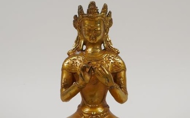 A Sino Tibetan gilt bronze figure of Buddha seated...