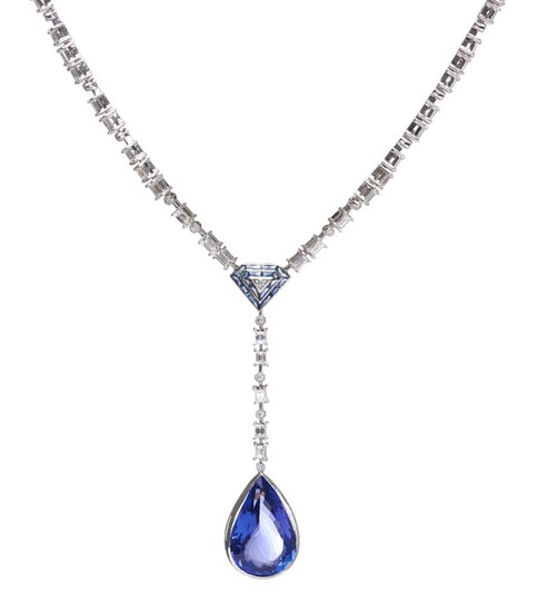 A TANZANITE AND DIAMOND NECKLACE-Featuring a pear cut tanzanite weighing 14.0cts, suspended on an iolite and diamond set pendant dro...