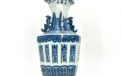 A TOUCH OF CHINA: VINTAGE PORCELAIN VASES WITH HEXAGONAL SHAPE AND BLUE AND WHITE ACANTHUS DESIGN.