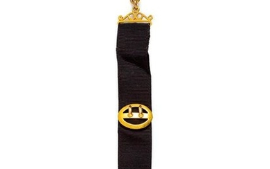 A Yellow Gold Fob with Attached Charms