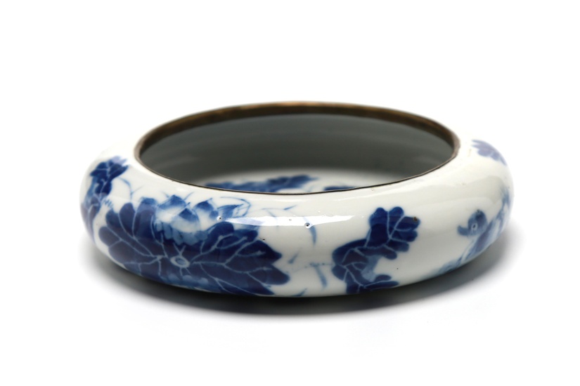 A blue and white porcelain brush pot painted to interior and exterior with lotus flowers