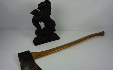 A cast iron doorstop in form of lion rampant, 39cm high; together with an Elwell 4.5 felling axe (