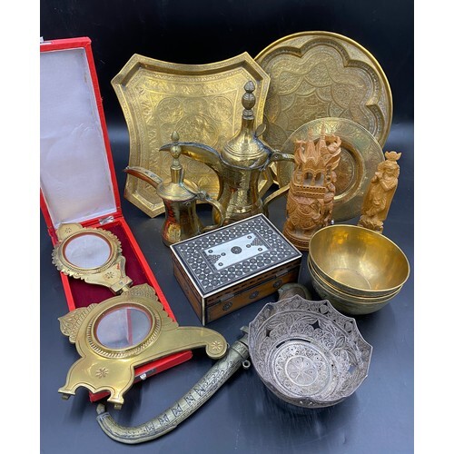 A collection of Middle Eastern brass and other items to incl...