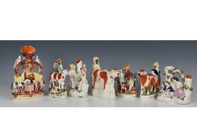 A collection of Staffordshire Spill Vases, one in the form o...