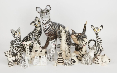 A collection of black and white striped ceramic cats, to include; examples of studio pottery and factory made cats, examples from Babbacombe, and High Bank porcelain, tallest 36cm high (19)