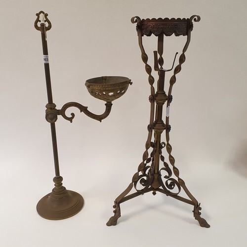 A copper and brass oil lamp stand, 56 cm high, and a brass a...