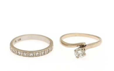 A diamond solitaire ring and an eternity ring respectively set with one or numerous brilliant-cut diamonds, mounted in 14k white gold. Size 58 and 59. (2)