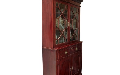 A good George III mahogany cupboard bookcase of small propor...