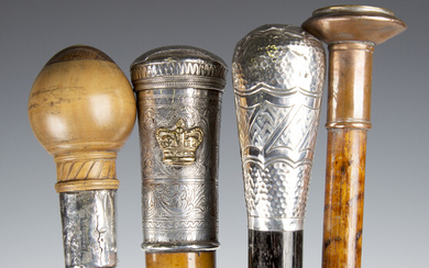A group of four walking canes, including a 19th century Malacca walking cane with Burmese engraved w