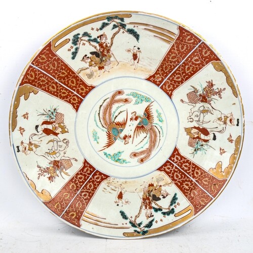 A large Chinese porcelain charger, with hand painted and gil...