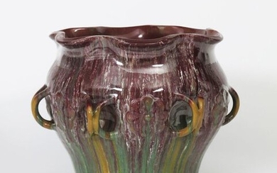 A large Linthorpe Pottery vase with loop handles designed by Dr Christopher Dresser, shape no.881, the shouldered, dimpled body with applied conjoined loop handles, glazed with a streaked aubergine, green and ochre glaze impressed marks, professional...