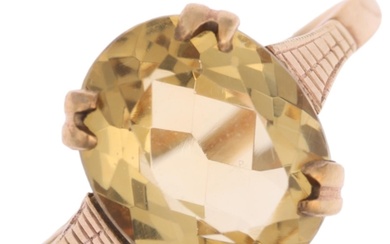 A mid-20th century 9ct gold citrine dress ring, set with ova...