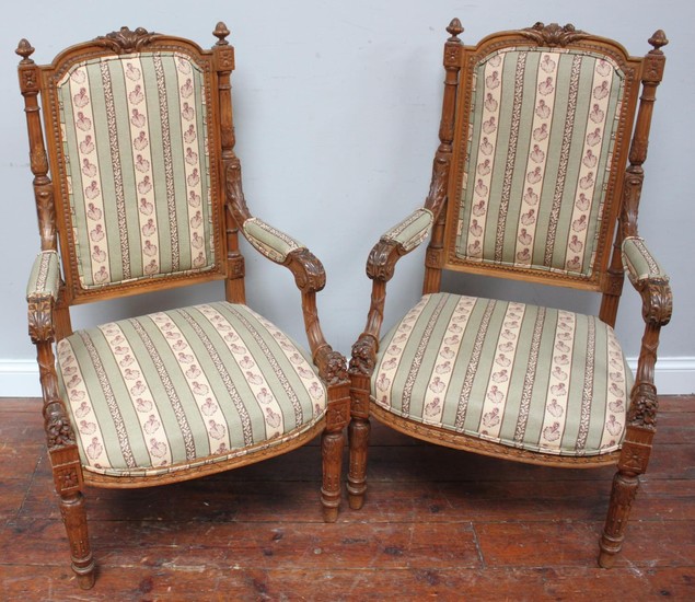 A pair of 19th century French walnut open armchairs, with fi...
