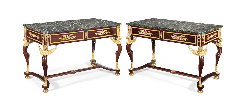 A pair of French early 20th century mahogany and gilt bronze mounted side tables