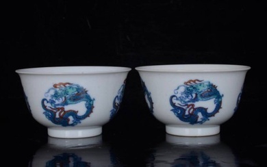 A pair of Qing Kangxi Doucai round dragon pattern cups