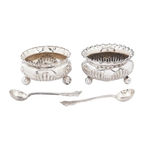 A pair of Victorian silver salt cellars, with crimpled ...