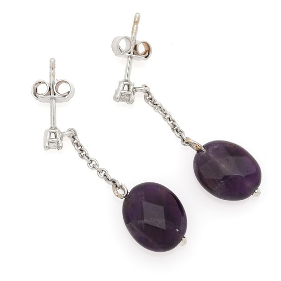 A pair of amethyst and diamond ear pendants each set with a facetted amethyst and a brilliant-cut diamond, mounted in 14k white gold. L. 2.8 cm. (2)