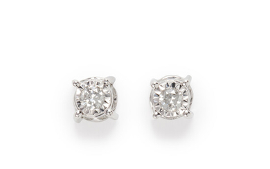 A pair of diamond and fourteen karat white gold stud earrings