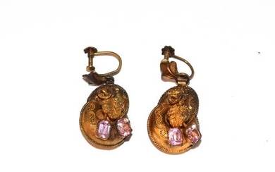 A pair of drop earrings with pink stones, the yellow...