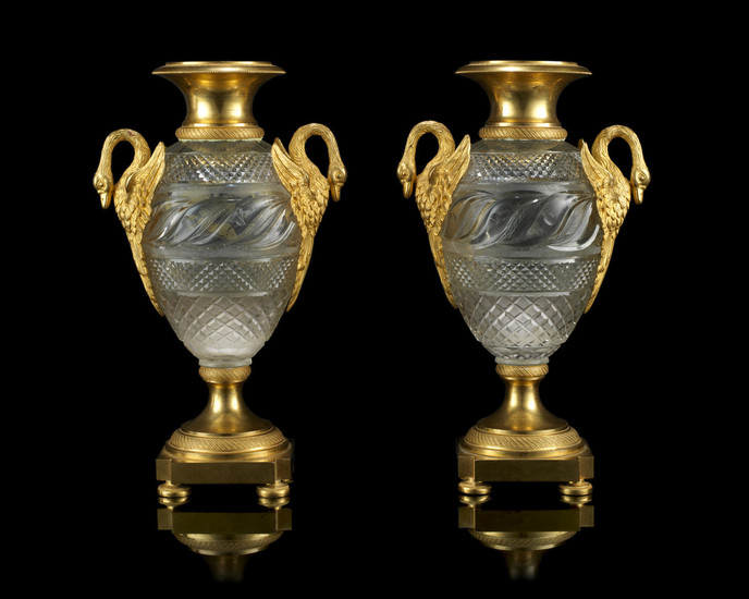 A pair of early 19th century Russian gilt bronze and cut glass vases
