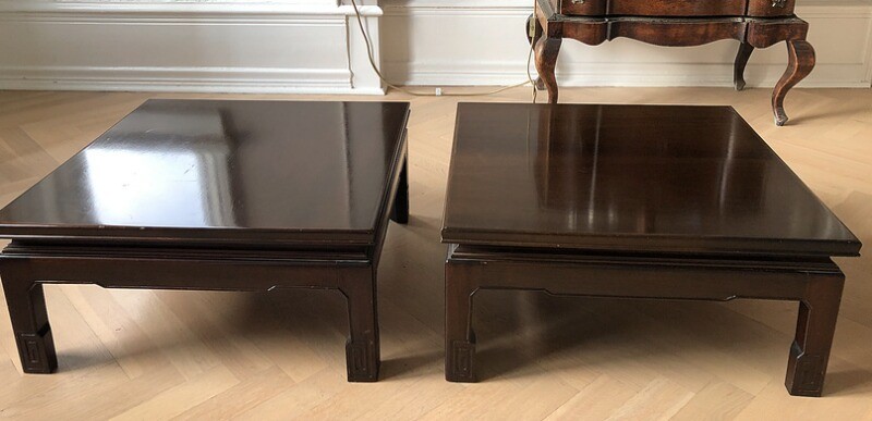 A pair of low square Chinese hardwood tables. Late 20th century. H. 26 cm. L. 55 cm. W. 55 cm. (2)