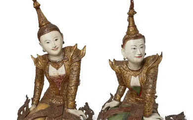 A pair of painted and gilt-wood, glass-inlaid figures of female devotees Thailand,...
