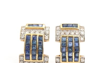 A pair of sapphire and diamond earrings set with baguette-cut sapphires and brilliant-cut diamonds, mounted in 18k gold. L. 2.2 cm. Weight app. 5.5 g. (2)
