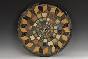 A pietra dura circular table top, inlaid in malachite