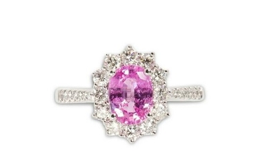 A pink sapphire, diamond and platinum ring