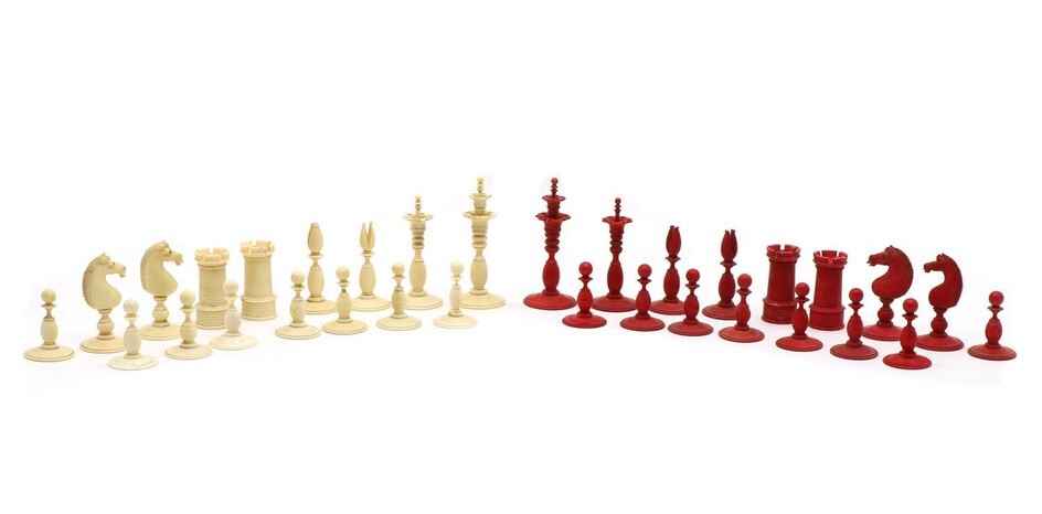 A plain and stained ivory chess set