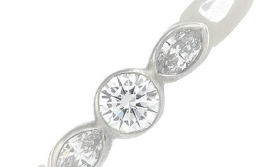 A platinum vari-cut diamond three-stone ring.Total