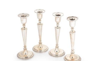A set of 4 Elizabeth II silver candlesticks