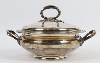 A silver-covered vegetable dish, the edges fretworked, the grip and handles forming intersecting laurel branches.