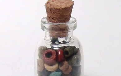 A small bottle of ancient Egyptian beads