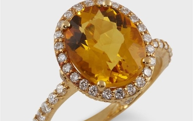 A yellow beryl, diamond, and eighteen karat gold ring...