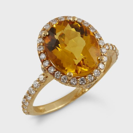 A yellow beryl, diamond, and eighteen karat gold ring