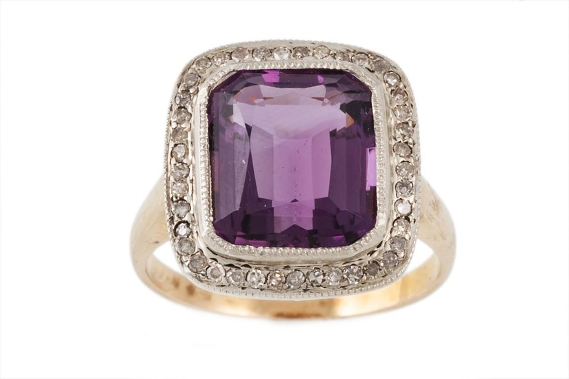 AN AMETHYST AND DIAMOND CLUSTER RING, the trap cut amethyst ...