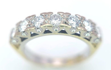 An 18K Yellow Gold Diamond Half Eternity Ring. 0.70ctw,...