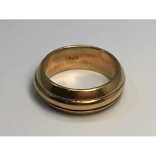An 18ct gold three row band with canted sides, marked ‘750’,...