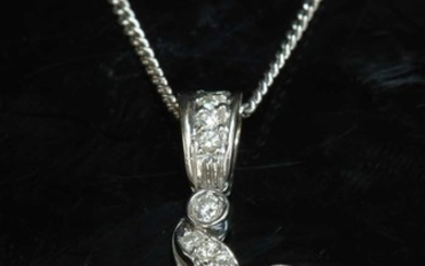 An 18ct white gold diamond set cross and chain