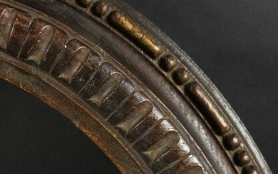 An 18th Century Carved and Moulded Oval Frame. 20.75" x