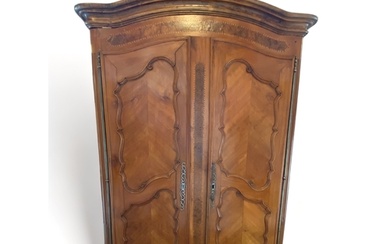 An 18th century French Provincial chestnut and burr elm armo...