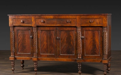 An American Empire Carved and Highly Figured Mahogany and Cherrywood Sideboard
